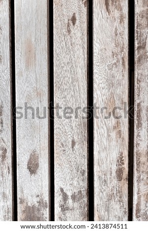 Brown and white rustic wood Ideal as a background, texture and abstract design image. Vertical photo and selective focus.