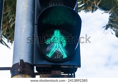 Green pedestrian light at a pedestrian crossing