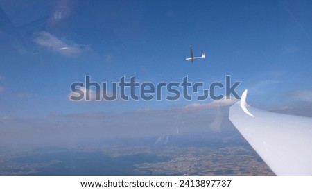 Sailplane Wing View blue sky duo Discus. High quality photo