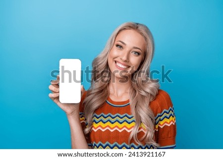 Photo of funky toothy girl dressed print shirt rising apple iphone samsung modern device empty space isolated blue color background