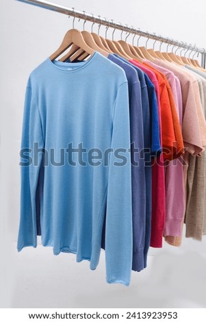 Row of red neck long sleeve with color knitted
 sweatshirt, n hanger
