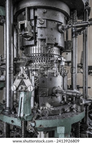 Close up of a historic textile machine. Royalty-Free Stock Photo #2413926809