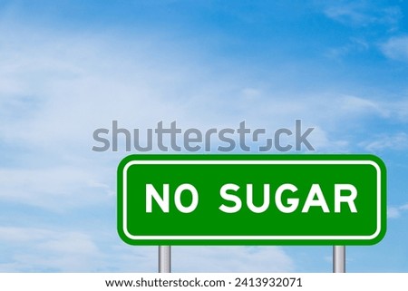 Green color transportation sign with word no sugar on blue sky with white cloud background Royalty-Free Stock Photo #2413932071