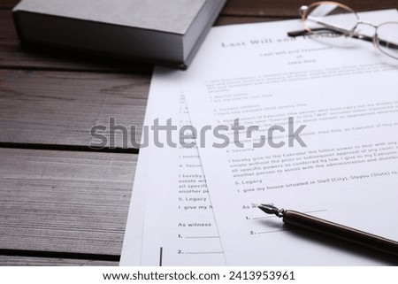 Last Will and Testament, glasses, pen and book on wooden table, closeup