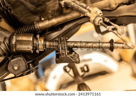 Photo of dismantled car axles, highlighting the complex inner workings of automotive mechanics. Royalty-Free Stock Photo #2413971161