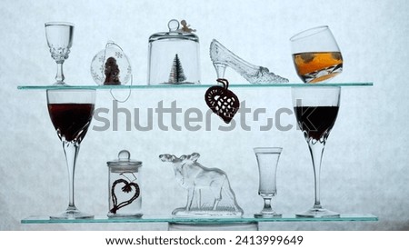 silhouette composition for Christmas and New Year with alcohol and caviar, decorations on a natural background