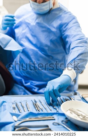 dentist tools and burnishers on a dentist chair in Dentist Clinic. Different dental instruments and tools in a dentists office. dentist and dental equipment in hospital Royalty-Free Stock Photo #2414010225
