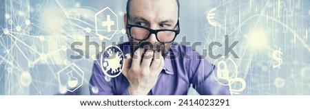 A cross-eyed bearded man is looking into the frame. Eye disease. The concept of inexperienced specialist. Spy neighbor. Royalty-Free Stock Photo #2414023291