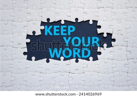 Keep your word symbol. Concept words Keep your word on white puzzle. Beautiful deep blue background. Business and Keep your word concept. Copy space. Royalty-Free Stock Photo #2414026969