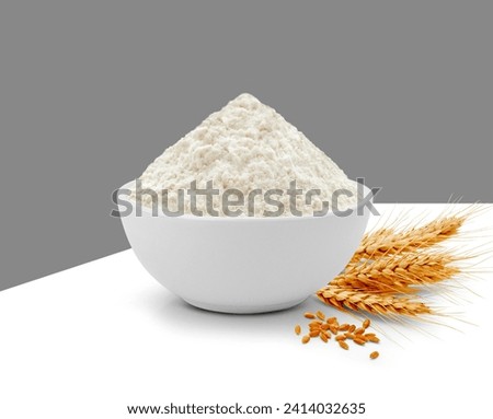 Wheat Flour in White Bowl isolated on white background Royalty-Free Stock Photo #2414032635