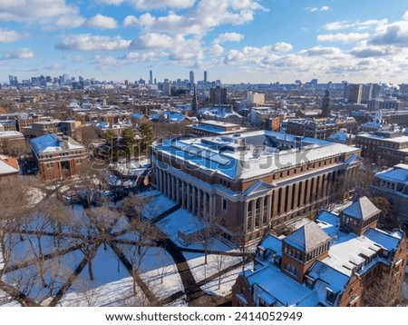 Widener Library aerial view in winter at Old Harvard Yard with Boston skyline at the back in historic center of Cambridge, Massachusetts MA, USA. 