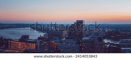 An aerial view of the Boston skyline at sunset.
