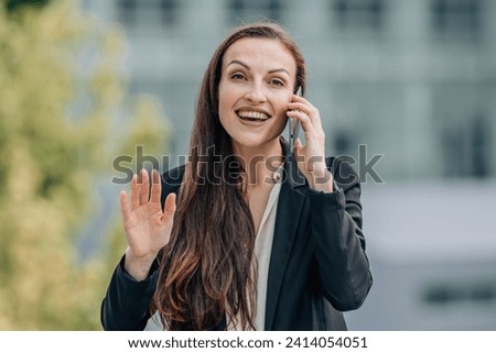 business woman outdoors talking on mobile phone