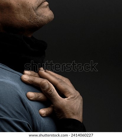 man praying to god Caribbean man praying with black grey background with people stock photo	