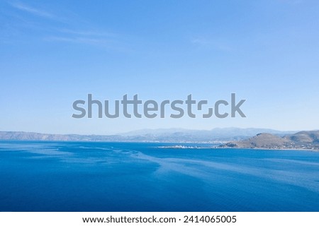 The port of Kissamos , in Europe, in Greece, in Crete, towards Kissamos, towards Chania, By the Mediterranean sea, in summer, on a sunny day. Royalty-Free Stock Photo #2414065005