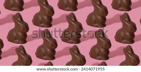 Chocolate rabbit pattern symbol to Easter holidays on a pink banner background
