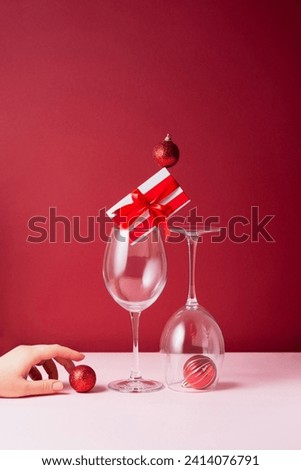 Still life of wine glasses on a red and pink background
