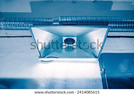 exhaust hood in a large production facility in harsh conditions of harmful gases and dust, close-up Royalty-Free Stock Photo #2414085615