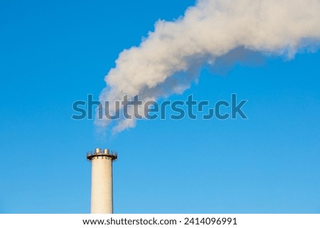 Steam power station chimney. Biomass power plant. Energy recovery facility. Smoke stack.