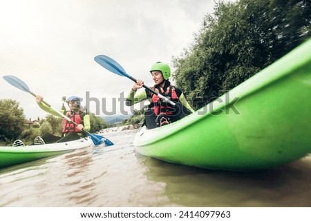 Germany- bavaria- allgaeu- couple kayaking on river iller Royalty-Free Stock Photo #2414097963