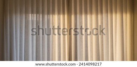 "Radiant and welcoming, this sunlit house curtain creates a warm and inviting atmosphere. Purchase this image and illuminate your projects with luminosity and comfort!" Royalty-Free Stock Photo #2414098217