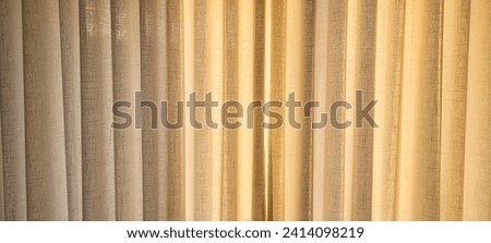 "Radiant and welcoming, this sunlit house curtain creates a warm and inviting atmosphere. Purchase this image and illuminate your projects with luminosity and comfort!" Royalty-Free Stock Photo #2414098219