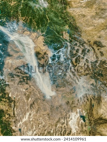 Fires and smoke in western United States morning overpass. Fires and smoke in western United States morning overpass. Elements of this image furnished by NASA.