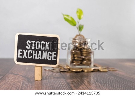 stock exchange written on newspaper on keyboard