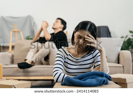 Unhappy young couple, having problems in relationship, thinking of breaking up or divorce, upset. Royalty-Free Stock Photo #2414114085