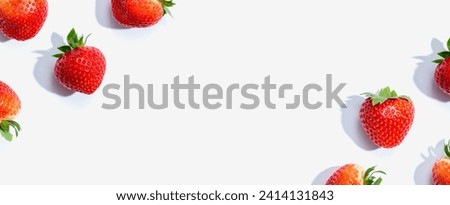 Fresh red strawberries overhead view - flat lay Royalty-Free Stock Photo #2414131843