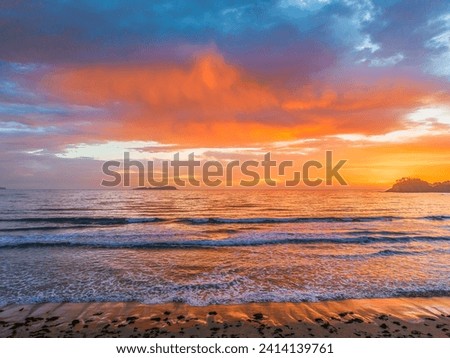 Early morning aerial views over the beach and sea with clouds at Surf Beach in the Eurobadalla Shire on the South Coast, NSW, Australia. Royalty-Free Stock Photo #2414139761