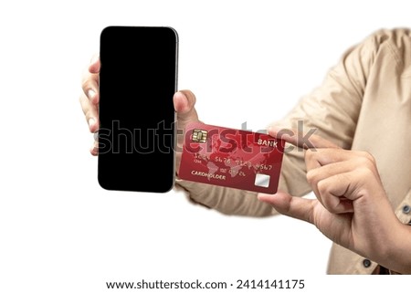 People hand showing credit cards and mobile phones with empty screens for mobile payment, banking, or online shopping. Empty mobile phone screen for copy space. Online payment concept