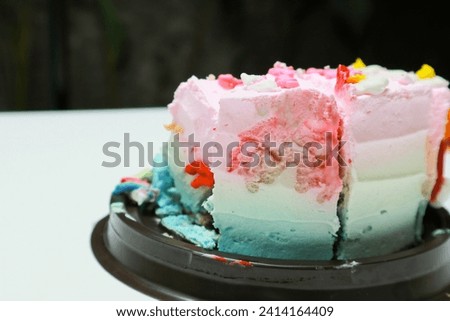 cut birthday cake isolated on white