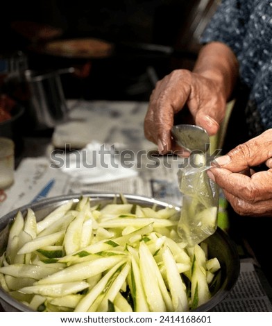 people doing traditional packaging of pickled food close up