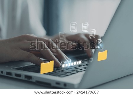 Hands typing on keyboard computer laptop for send document on internet. Data migration, Transfer file between folder, Backup data, Exchange file, DMS. Virtual document loading to another folder. Royalty-Free Stock Photo #2414179609