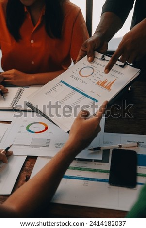 Male mature caucasian ceo businessman leader with diverse coworkers team, executive managers group at meeting. Multicultural professional businesspeople working together on research plan in boardroom. Royalty-Free Stock Photo #2414182037