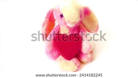 Toy bunny with a heart.  Preparation for a romantic holiday at home. Valentines Day, Birthday  and love Concept