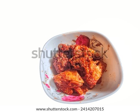 chicken chili sauce in a bowl on a white background