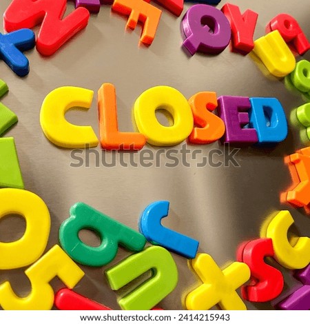 Closed written in Magnetic letters on a refrigerator