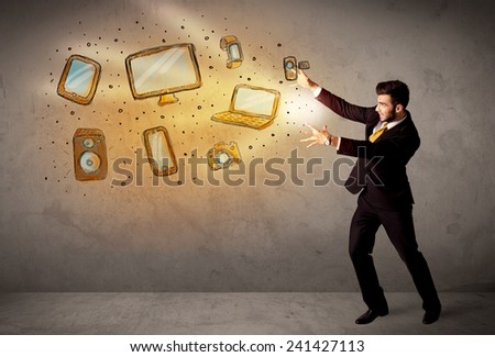 Man throwing hand drawn electronical devices concept