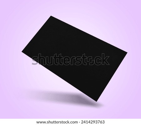 Blank business card in air on violet background. Mockup for design
