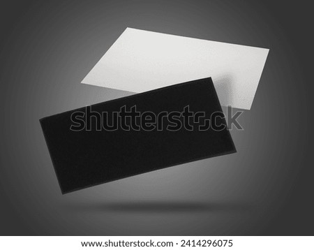 Blank business cards in air on grey background. Mockup for design