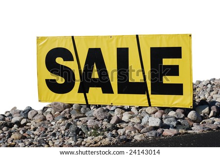 Extracted SALE sign with stone foreground.