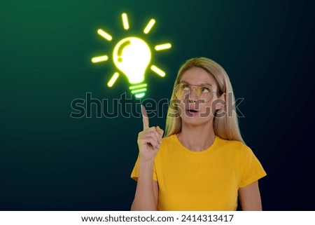 Idea generation. Woman and illustration of light bulb on dark green background