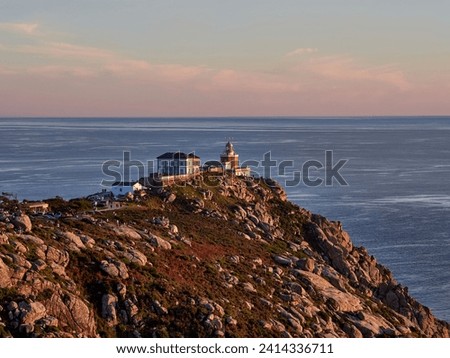 Finisterre Cape Lighthouse, Costa da Morte, Galicia, Spain. One of the most famous Lighthouse in Western Europe. Last stage in the Camino de Santiago. Royalty-Free Stock Photo #2414336711