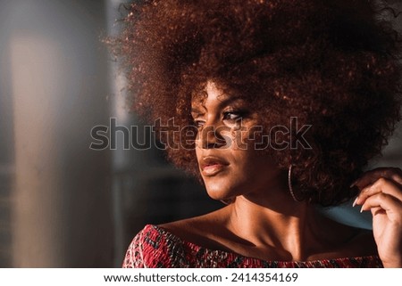 Portrait of woman with dyed ringlets Royalty-Free Stock Photo #2414354169