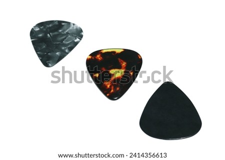 The guitar pick, a small, triangular tool, enhances musical resonance. Its versatile design allows precise strumming and dynamic note articulation, shaping the guitarist's sonic expression.