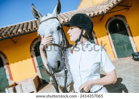 Young rider with horse stock photo