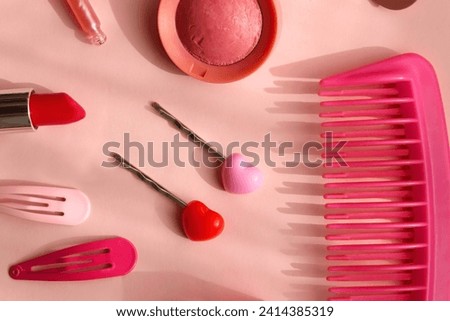Various pink accessories and make up products on bright pink background. Flat lay.