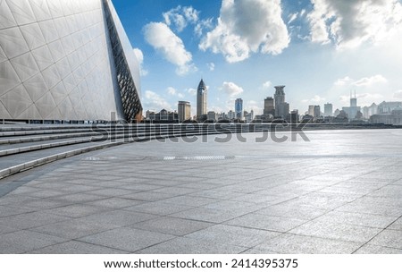 Empty square floor and brick wall with city skyline in Shanghai